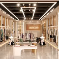 Stylish Clothing Store Interior With Clothing Displays Seating Area And Modern Lighting