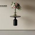 Designer Floral Arrangement With Pink White Flowers In Clear Glass Vase On Black Round Table