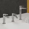 Three Silver Faucets On White Countertop With Dark Gray Yellow Background Marble Cube Red Cup