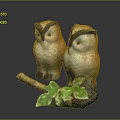 Two Ceramic Owl Figurines With Brown Feathers And Green Leaf Decor