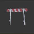 Red And White Striped Road Barrier With White Support Stands On Dark Surface