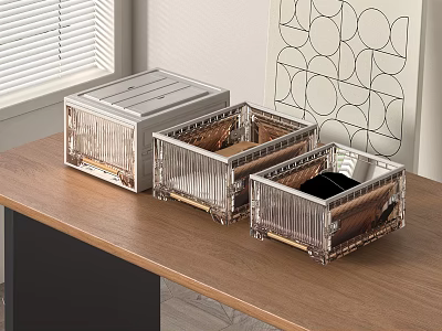 Three Transparent Storage Boxes with Gold Frame for Desk Organization on Wooden Table 3d model