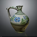 Traditional Ceramic Jug With Green And Blue Floral Patterns And Curved Handle