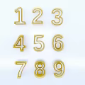 Golden Numbers 1 to 9 Arranged in Three Rows and Three Columns on White Background