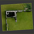 Ancient Castle Ruins Architecture With Moss Covered Stone Walls And Green Grass Field