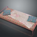 Pink Metal Bed Frame With Floral Pattern Mattress And Two Geometric Design Pillows