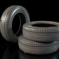 Three Car Tires Stacked and Leaning With Detailed Tread Pattern 3d model