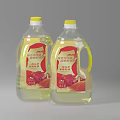 Two Bottles of Clear Edible Cooking Oil with Yellow Caps and Red Labels