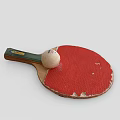 Worn Red Table Tennis Racket With Green Handle Yellow Label And White Ping Pong Ball