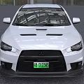 White Mitsubishi Sports Car With Green License Plate