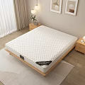Comfortable Quilted Mattress On Wooden Frame With Nightstand Table Lamp Vase And Framed