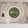 Shop Window Display With Circular Green Plant Wall Pink Flowers Ring Lighting Mannequin Green Chair