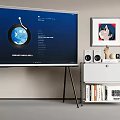 Modern TV on Tripod Stand with Cabinet Speakers Wall Art Decorations and Bookshelf