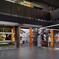 Modern Fitness Gym Interior With Orange J Shaped Dumbbell Logo And Glass Walls