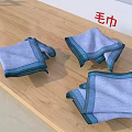 Soft Light Blue Towels With Striped Edges Folded On Wooden Table