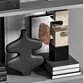 Modern Decorative Ornament Combination with Abstract Sculptures Geometric Shapes and Textured Disks on Display Shelf