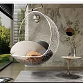 White Mesh Hanging Chair With Cushions And Blanket Indoor Near Window Marble Wall Green Plants