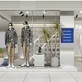 Stylish Clothing Store Featuring Trendy Jackets And Fashion Mannequins In Modern Window