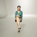 Woman Sitting in Light Background Wearing Green Top Gray Skirt Holding Notebook and High Heels