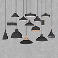 Modern Black And Copper Pendant Lights With Various Designs On Gray Wall