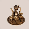 Elegant Golden Wine Bottle And Glasses Set With Intricate Patterns On Decorative Tray