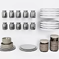 Stylish Kitchenware Collection Including Stacked Plates Stainless Steel Jars Ceramic Bowls and Woven Detail Jars