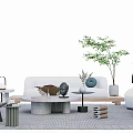 Modern Living Room White Sofa With Round Stone Coffee Table Green Plant And Decorative Items