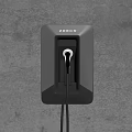 Tesla Wall Mounted Electric Vehicle Charger With Orange Accents On Gray Wall