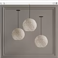 Three White Spherical Pendant Lights With Moon Surface Texture Black Cords And Light Wall Background 3d model