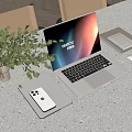 Modern Laptop Setup With Phone Tablet Mouse And Notebook Near Green Plant On Gray Desk