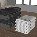 Soft Dark and Light Colored Towels Neatly Stacked on Wooden Table in Modern Room