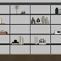 Modern Black Frame Shelving Unit With Multiple Tiers Displaying Vases Books Sculptures On White Wall