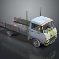 Old Rusty Blue And White Truck With Open Bed And Metal Rails