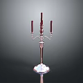 Elegant Silver Candelabra With Three Red Candles And Polished Base