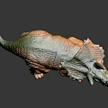 Vibrant Triceratops Dinosaur Toy Figure With Green Orange Hues and Detailed Texture
