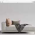 Modern Comfortable Light Toned Chaise Lounge With Beige Gray Pillows And Gray Blanket