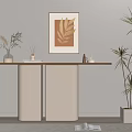 Modern Console Table Setup With Framed Golden Leaf Artwork And Tall Plant In White Pot