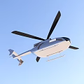 Modern Helicopter With Black Rotors And Silver Body Flying In Clear Sky