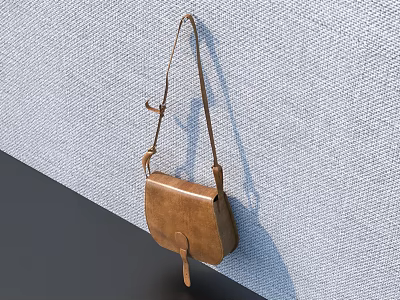 Brown Leather Satchel With Shoulder Strap Hanging On Light Blue Fabric Wall 3d model