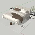 Double Bed With Light Colored Headboard White Comforter Brown Pillows Bedside Tables And Green Plant