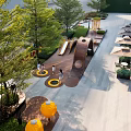 Outdoor Children's Play Area With Safe Wooden Play Structures And Lush Green Surroundings