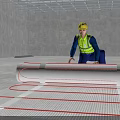 Worker in Yellow Hard Hat Laying Underfloor Heating Mesh in Interior Construction Site