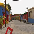 Vibrant Commercial Street With Colorful Buildings Cobblestone Path Potted Plants Red And Yellow Chairs