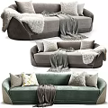 Gray and Green Upholstered Sectional Sofa with Plush Pillows and Cozy Blankets