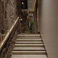 Warm Restaurant Entrance With Stone Columns Wooden Panels And Green Plants