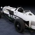 Vintage White Race Car With Open Design And Exposed Mechanical Parts On Gray Surface