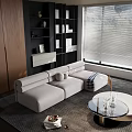 Modern Living Room Interior Design With Beige Sectional Sofa Black Bookshelves And Round Coffee Table