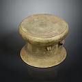 Vintage Brass Colored Drum Shaped Furniture Stool With Textured Surface And Decorative Handles