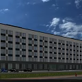 Modern Office Building With Glass Facade Large Windows Parking Lot And Blue Sky