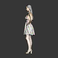 Woman in colorful floral dress against black background with white high heels and hand on hip